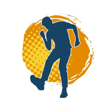 Hareket halindeki bir erkek dansçının silueti. Dans eden zayıf bir adamın silueti..