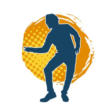 Hareket halindeki bir erkek dansçının silueti. Dans eden zayıf bir adamın silueti..