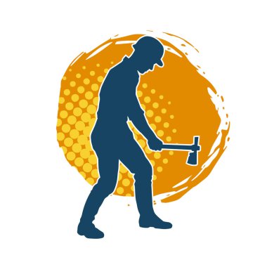 Hareket halindeki bir işçinin silueti, baltasını kullanarak poz verir..