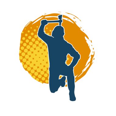 Hareket halindeki bir işçinin silueti, baltasını kullanarak poz verir..