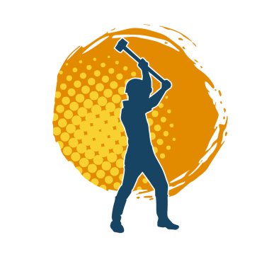 Çalışan bir işçinin silueti balyoz aletini kullanarak hareket halinde poz verir.