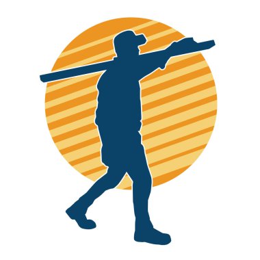 Tahta taşıyan bir inşaat işçisinin silueti..