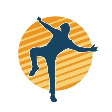 Hareket halindeki bir erkek dansçının silueti. Dans eden zayıf bir adamın silueti..