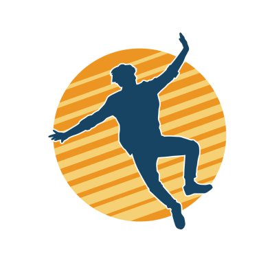 Hareket halindeki bir erkek dansçının silueti. Dans eden zayıf bir adamın silueti..