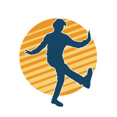 Hareket halindeki bir erkek dansçının silueti. Dans eden zayıf bir adamın silueti..