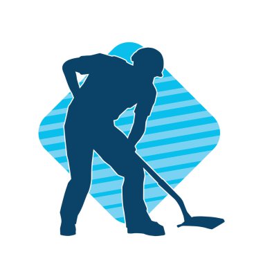 Kürek taşıyan bir işçinin silüeti. Bir işçinin hareket halindeki silueti kürek aracı kullanarak poz verir.
