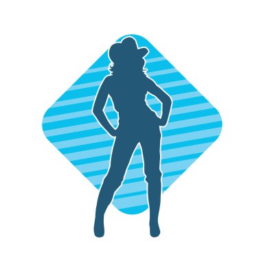 Kovboy kostümü giymiş bir kadın modelin silueti. Poz vermiş bir kovboy kızın silueti..