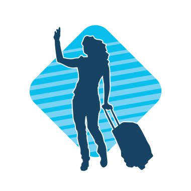 Sıska, modaya uygun bir kadın modelin silueti, yürürken ve el sallarken seyahat valizleri taşıyor.