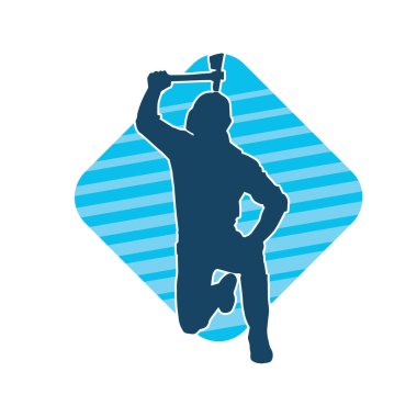 Hareket halindeki bir işçinin silueti, baltasını kullanarak poz verir..