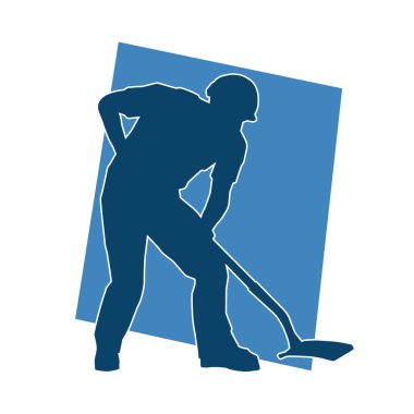 Kürek taşıyan bir işçinin silüeti. Bir işçinin hareket halindeki silueti kürek aracı kullanarak poz verir.