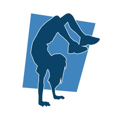 Dans eden ve amuda kalkma pozu veren genç bir kızın silueti. 