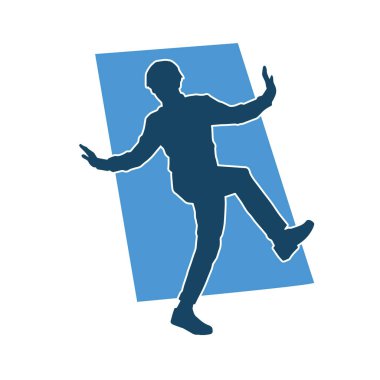 Hareket halindeki bir erkek dansçının silueti. Dans eden zayıf bir adamın silueti..