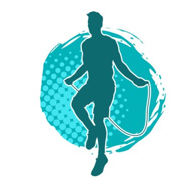 Sportif bir erkeğin silueti ip atlama egzersizi yapıyor. Sportif bir adamın silueti atlama ipine atlıyor..