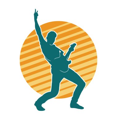 Elektro gitar çalan bir müzisyenin silueti. Bir erkek gitaristin silueti.