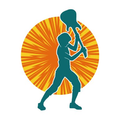 Elektro gitarı parçalayan bir rock müzisyeninin silueti..