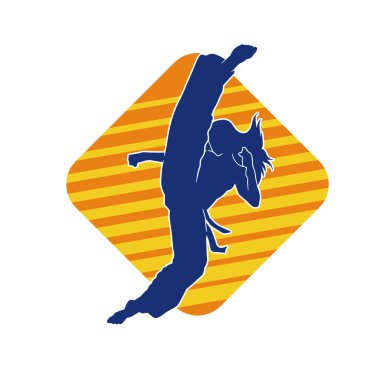 Dövüş sanatları tekmesi atan bir kadının silueti. Sportif bir kadının silueti tekme hareketi yapıyor..