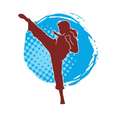 Dövüş sanatları tekmesi atan bir kadının silueti. Sportif bir kadının silueti tekme hareketi yapıyor..