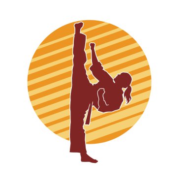 Dövüş sanatları tekmesi atan bir kadının silueti. Sportif bir kadının silueti tekme hareketi yapıyor..
