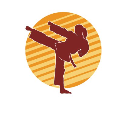 Dövüş sanatları tekmesi atan bir kadının silueti. Sportif bir kadının silueti tekme hareketi yapıyor..