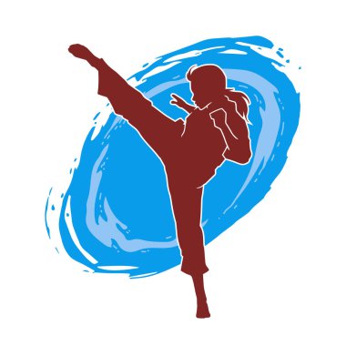 Dövüş sanatları tekmesi atan bir kadının silueti. Sportif bir kadının silueti tekme hareketi yapıyor..