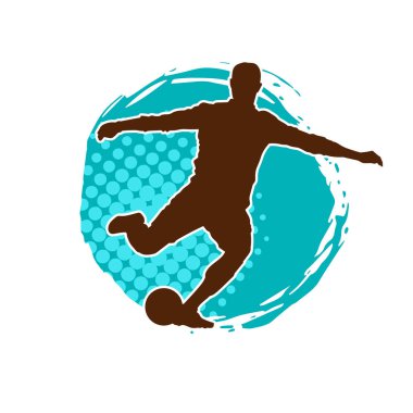 Top tekmeleyen bir erkek futbolcunun silueti. Hareket halindeki bir futbolcunun silueti.