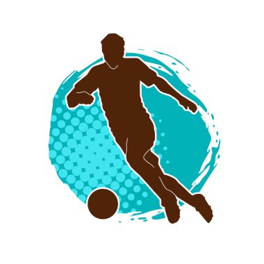 Futbol oynayan bir adamın silüeti. Hareket halindeki bir futbolcunun silueti.