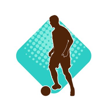 Futbol oynayan bir adamın silüeti. Hareket halindeki bir futbolcunun silueti.