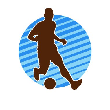 Top tekmeleyen bir erkek futbolcunun silueti. Hareket halindeki bir futbolcunun silueti.
