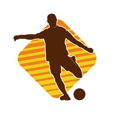 Top tekmeleyen bir erkek futbolcunun silueti. Hareket halindeki bir futbolcunun silueti.