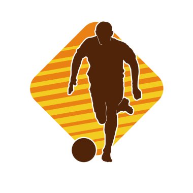 Top tekmeleyen bir erkek futbolcunun silueti. Hareket halindeki bir futbolcunun silueti.