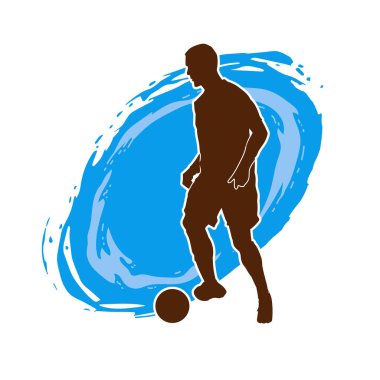 Top tekmeleyen bir erkek futbolcunun silueti. Hareket halindeki bir futbolcunun silueti.