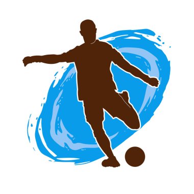 Top tekmeleyen bir erkek futbolcunun silueti. Hareket halindeki bir futbolcunun silueti.