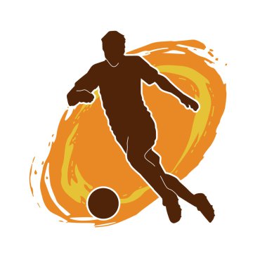 Top tekmeleyen bir erkek futbolcunun silueti. Hareket halindeki bir futbolcunun silueti.