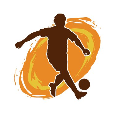 Top tekmeleyen bir erkek futbolcunun silueti. Hareket halindeki bir futbolcunun silueti.