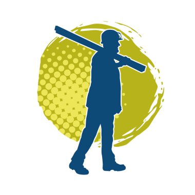 Tahta taşıyan bir inşaat işçisinin silueti..