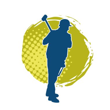 Çalışan bir işçinin silueti balyoz aletini kullanarak hareket halinde poz verir.