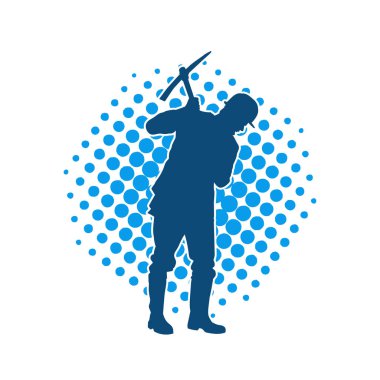 Görev sırasında baltayla dolaşan işçi kostümlü bir adamın silüeti. Bir madencinin hareket halindeki silueti balta aracı ile poz verir.