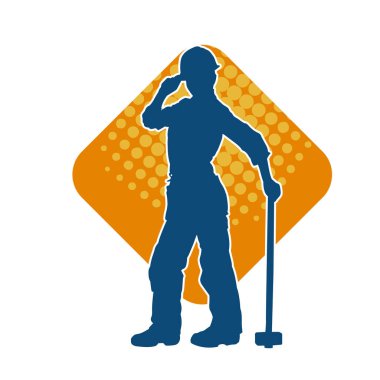 Çalışan bir işçinin silueti balyoz aletini kullanarak hareket halinde poz verir.