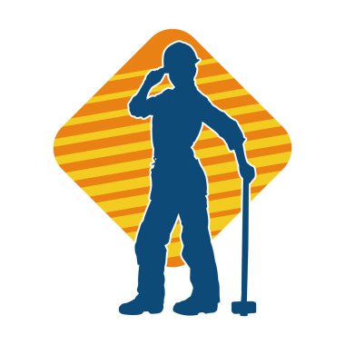 Çalışan bir işçinin silueti balyoz aletini kullanarak hareket halinde poz verir.