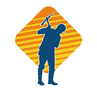 Görev sırasında baltayla dolaşan işçi kostümlü bir adamın silüeti. Bir madencinin hareket halindeki silueti balta aracı ile poz verir.