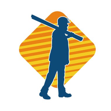 Tahta taşıyan bir inşaat işçisinin silueti..