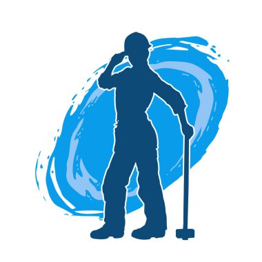 Çalışan bir işçinin silueti balyoz aletini kullanarak hareket halinde poz verir.