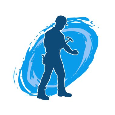 Çekiç aleti taşıyan bir işçinin silüeti. Hareket halindeki bir işçinin silueti çekiç aleti ile poz verir.