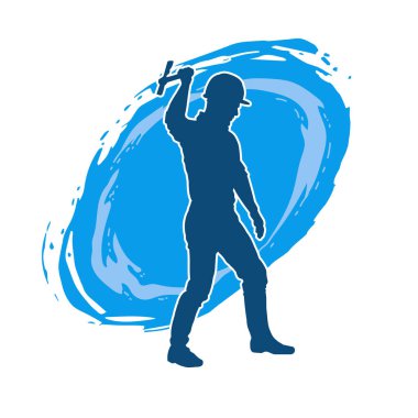 Hareket halindeki bir işçinin silueti, baltasını kullanarak poz verir..