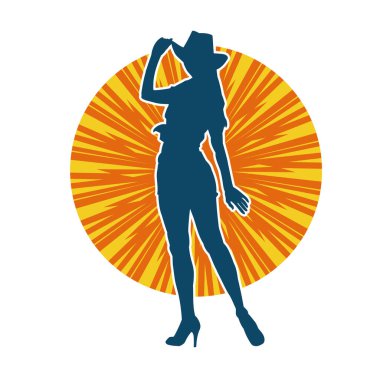 Kovboy kostümü giymiş bir kadın modelin silueti. Poz vermiş bir kovboy kızın silueti..