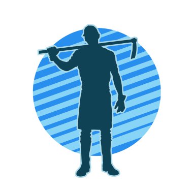 Uzun şaft baltası taşıyan bir erkek işçinin silueti.