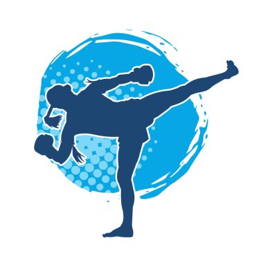 Hareketli erkek kickboksör atletinin silueti. Tekme atan bir adamın silueti..