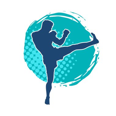 Hareketli erkek kickboksör atletinin silueti. Tekme atan bir adamın silueti..