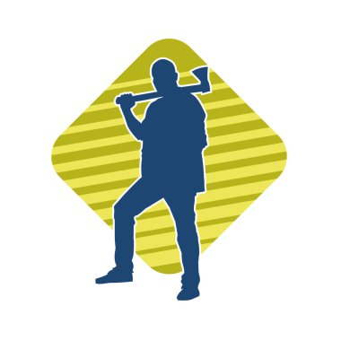 Balta taşıyan bir adamın silüeti. Balta taşıyan erkek bir oduncunun silueti..