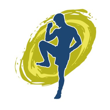 Hareketli erkek kickboksör atletinin silueti. Tekme atan bir adamın silueti..